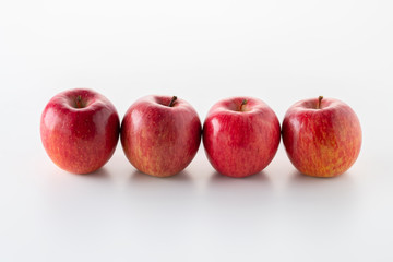 Red apples on white background