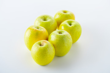 Green apples on white background