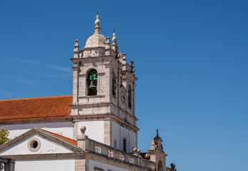 Fototapeta na wymiar Bell towers on the roof of the Nossa Senhora da Nazare church