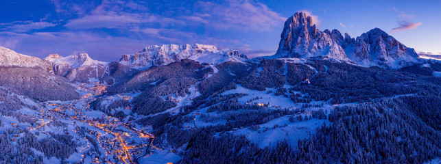 Beautiful panoramic view of Dolomites mountains at dusk during winter time. Magical winter mountain...