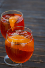 Aperol spritz drink in a wineglass. Ice and slice of orange