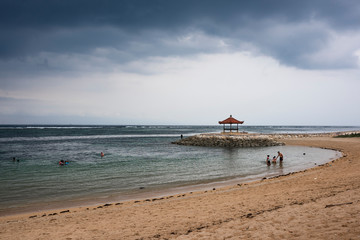 Sand beach with a romantic pavilion © Yana Shevchenko