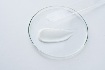 Fototapeta na wymiar medical issues, white cream on glass