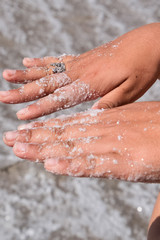 Fototapeta premium Salt on the girl's hands