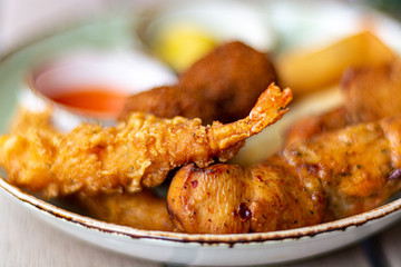 Dutch snacks for beer or wine, tempura shrimps, skewered chicken, bitterballs and hot dip sauces