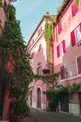 Old street in Trastevere in Rome, Italy. Trastevere is rione of Rome, on the west bank of the Tiber in Rome, Lazio, Italy. Architecture and landmark of Rome