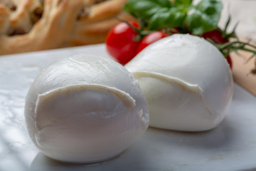 Balls of buffalo mozzarella, soft Italian scheese made from the milk of Italian Mediterranean buffalo