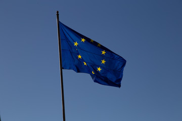 European Union flag on a blue sky bakcgorund