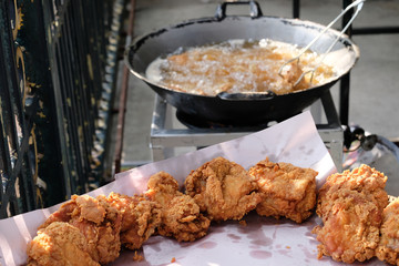 selected focus, Crispy fried chicken and blurred the pan is frying the chicken.
