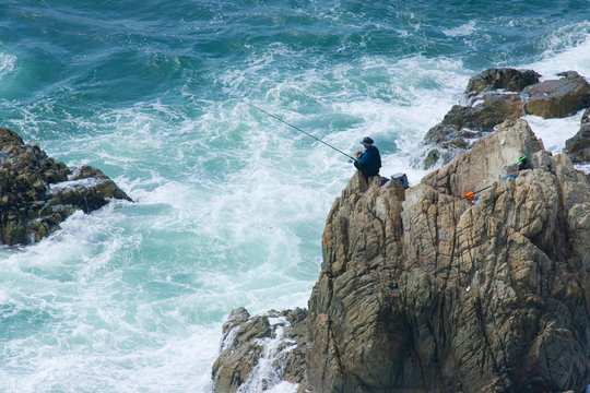 fishing from the rocks on the seashore. the rocks on the seashore.
