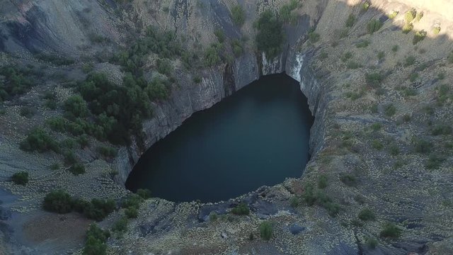 4K high quality sunny sunrise morning aerial panorama footage of spectacular scenic The Big Hole water filled old diamond mine site in Kimberley, capital of Northern Cape Province, South Africa
