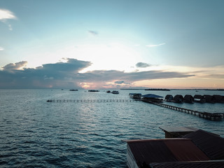 Aerial wide panorama of Bum Bum Island against an early morning blue sky colourful sunrise in...