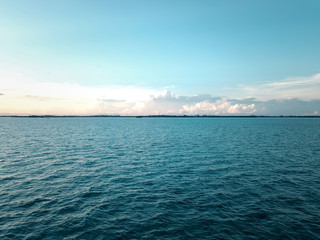 Fototapeta premium Aerial wide panorama of Bum Bum Island against an early morning blue sky colourful sunrise in Semporna, Borneo Sabah, Malaysia.