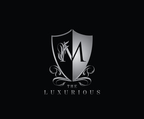 Luxury Guard M Letter Logo Icon. Silver M With Classy Shield Shape design perfect for fashion, Jewelry, Beauty Salon, Cosmetics, Spa, Hotel and Restaurant Logo. 