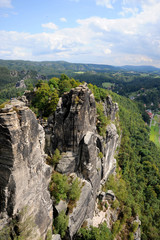 Fototapeta na wymiar Sheer cliffs of the Elbe Sandstone Mountains in the state of Saxony in southeastern Germany and the North Bohemian region of the Czech Republic.