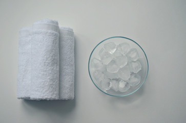white cotton towels, ice cubes, spa on white background