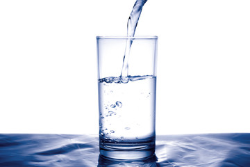 Clean water for good health. Pouring Fresh Pure Water From Pitcher Into A Glass on table wooden. Health And Diet Concept. Lifestyle Healthcare And Beauty.