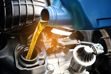 Refueling and pouring oil quality into the engine motor car Transmission and Maintenance Gear...