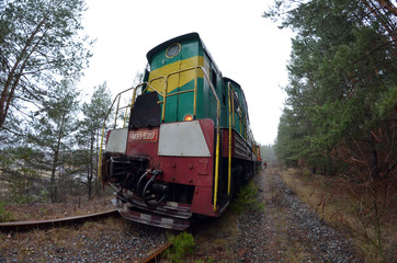 Special railway service train cuts overhanging branches. Near Kiev, Ukraine