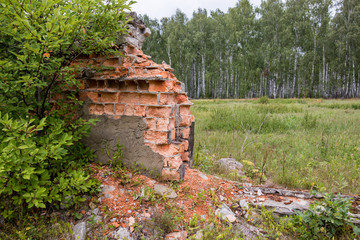 The remains of a brick wall of a country house