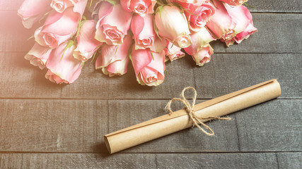 Bouquet of roses and letter scroll - 311984365