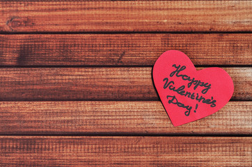 Cut out of red paper hearts on wooden background, congratulation with Valentine's day, top view - 311984501