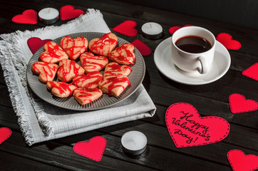 cookie-hearts, paper hearts, candles, boxes with presents and a Cup of black coffee, congratulation with Valentine's day. - 311984525