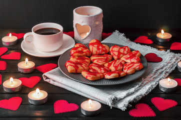 cookie-hearts, paper hearts, candles, boxes with presents and a Cup of black coffee, congratulation with Valentine's day. - 311984551