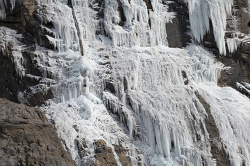 Fototapeta na wymiar Mountain with an iced waterfall