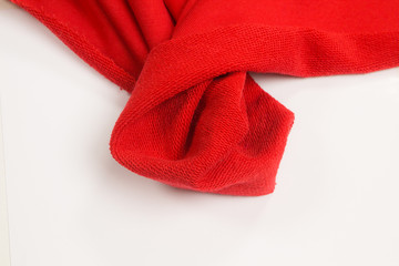 Cotton fabric on white background. Red textile
