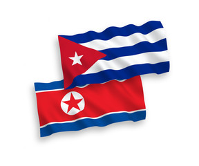 Flags of North Korea and Cuba on a white background