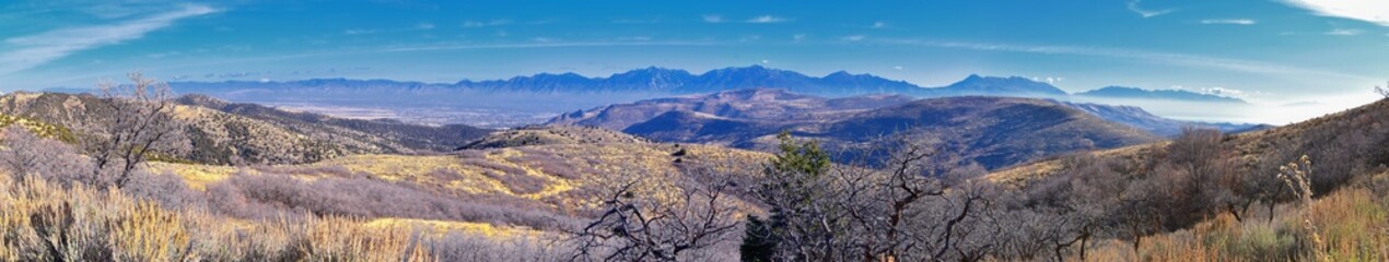 Fototapeta premium Views of Wasatch Front Rocky Mountains from the Oquirrh Mountains with fall leaves, Hiking in Yellow Fork trail and Rose Canyon in Great Salt Lake Valley. Utah, United States. USA.