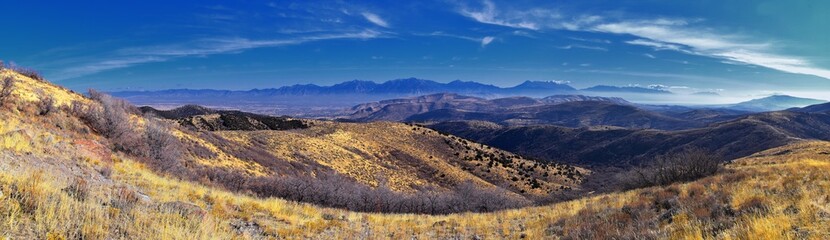 Fototapeta premium Views of Wasatch Front Rocky Mountains from the Oquirrh Mountains with fall leaves, Hiking in Yellow Fork trail and Rose Canyon in Great Salt Lake Valley. Utah, United States. USA.
