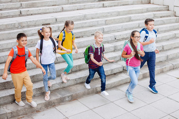 Obraz premium Teenagers with backpacks.