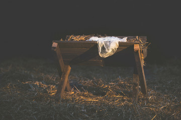 Manger with hay and a white cloth