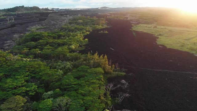 aerial of lava flow through forest in puna Hawaii,