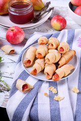 Shortbread rolled cookies with apple and pear jam filling