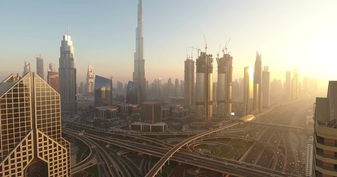 DUBAI, UAE - JANUARY 2, 2017: Aerial view of Burj Khalifa downtown Dubai at sunset. The Burj al Khalifa is the tallest structure in the world, standing at 829.8 m (2,722 ft). Scenic dusk 4K scene.