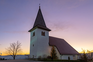 Fototapeta na wymiar St. Marjeta church on the top of Šmarjetna gora above Kranj at dusk, Slovenia 