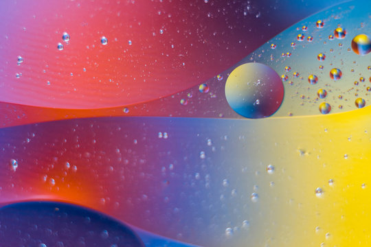 Abstract background of liquid and oily streaks.