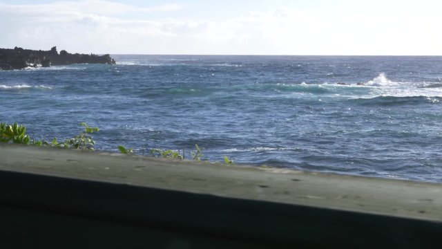 slide left reveal through window past columns at punaluu beach