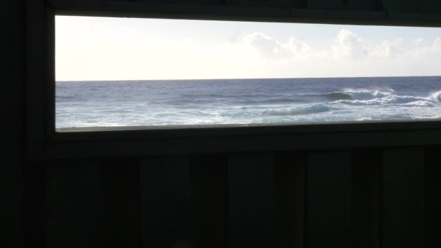ocean reveal through window slide right past columns at Whittington beach