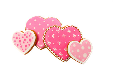 Background from pink cookies heart shaped with different patterns, isolated
