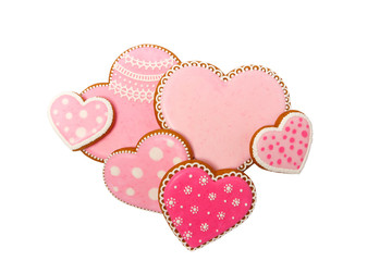 Background from pink cookies heart shaped with different patterns, isolated