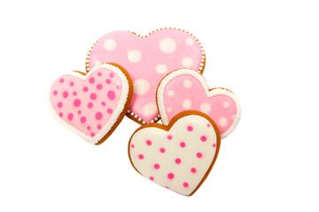 Background from pink cookies heart shaped with different patterns, isolated