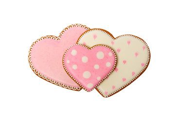 Background from pink cookies heart shaped with different patterns, isolated