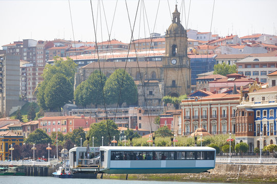 Bizkaia red iron hanging bridge and Nervion river. Euskadi