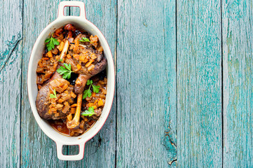 Duck legs in a baking dish