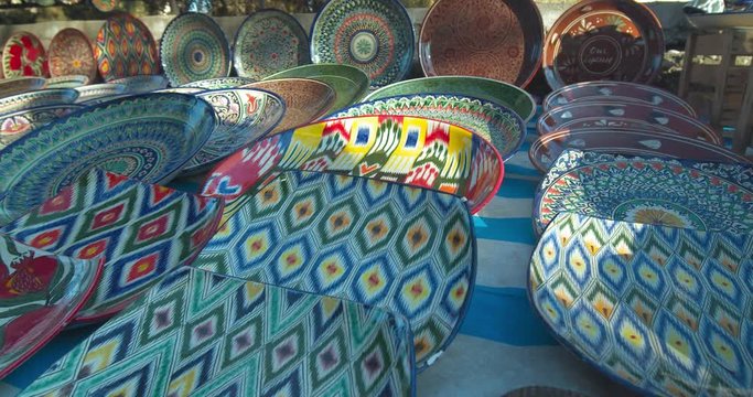 Sale of national ceramic plates (lyagan) at the Chorsu bazaar in the old town of Tashkent Uzbekistan Central Asia.
