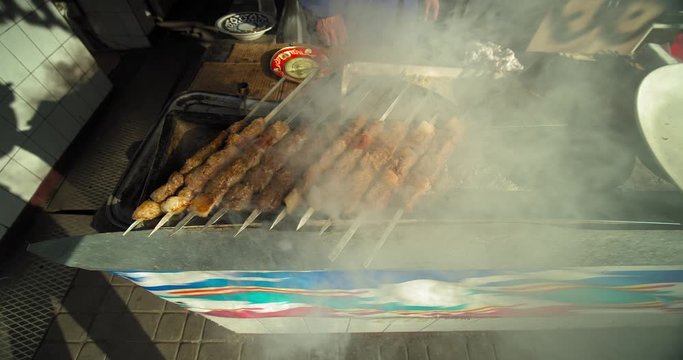 Shashlik (kebab) cooking for sale at the Chorsu bazaar in the old town of Tashkent Uzbekistan Central Asia.